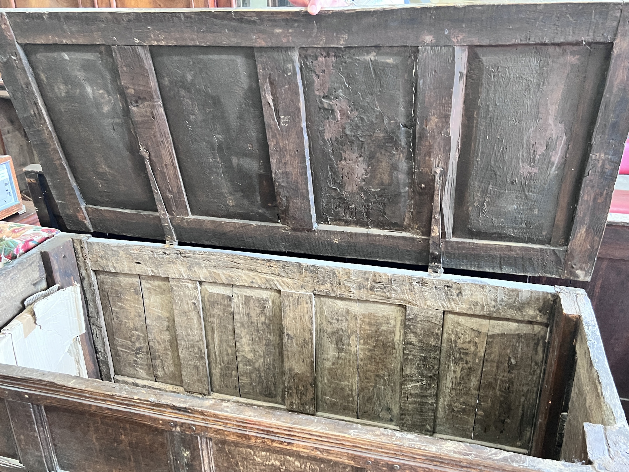 An 18th century panelled oak coffer, length 140cm, depth 61cm, height 92cm